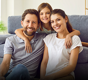 A happy smiling family of three, illustrating legal support for family law matters.