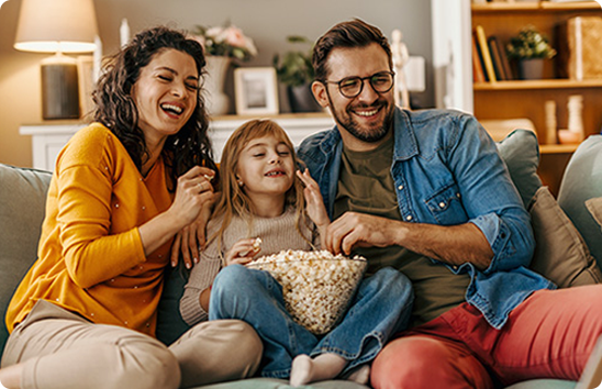 Happy family eating popcorn, representing Litem Law Group's compassionate family law services.